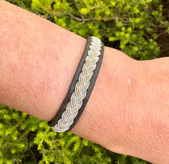 Traditional Sami reindeer leather bracelet. Gold and silver pewter braided. Unisex leather accessory.