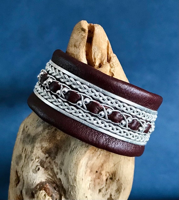 Traditional Sami inspired leather cuff, with pewter threads braiding and sterling silver beads.