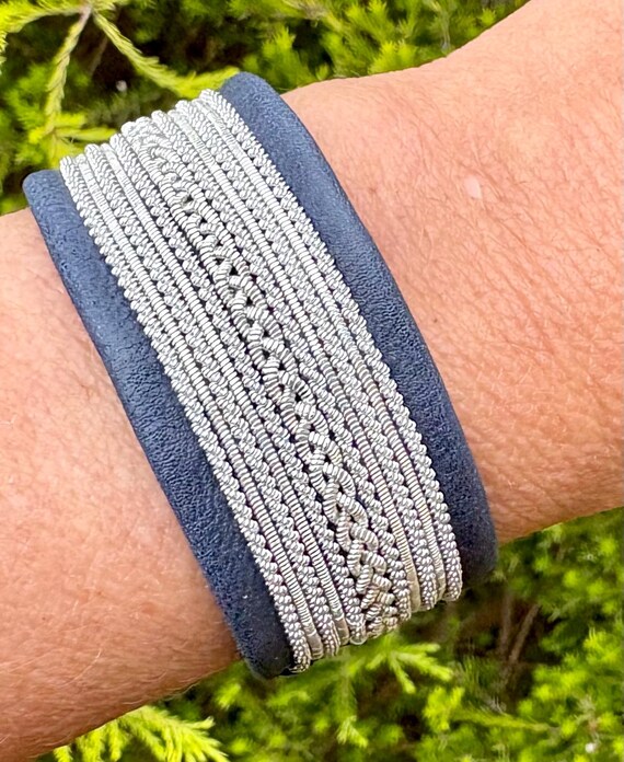 Traditional Lapland Nordic leather cuffs, with pewter threads braids and a shed antler button.