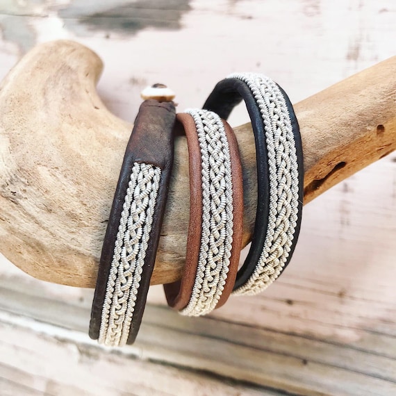 Sami Lapland leather bracelets with a braid of flat pewter threads and borders. A Nordic unisex design.