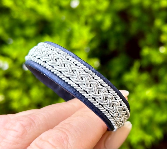 Traditional Sami inspired leather bracelet with borders of silver and pewter. Unisex leather accessory handmade to order.