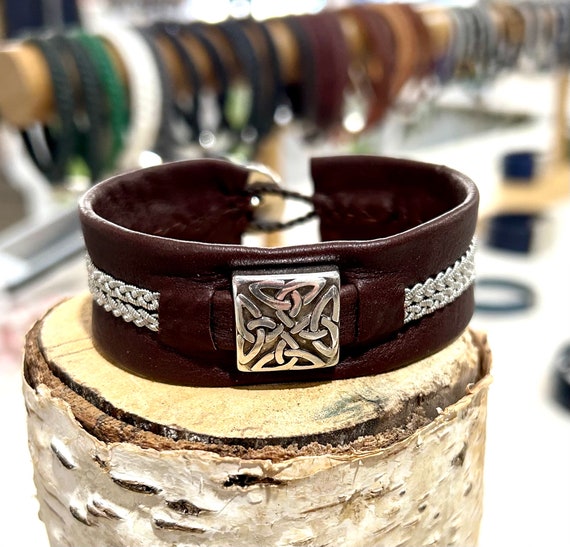 Unisex reindeer leather cuff with silver Trinity Celtic feature.