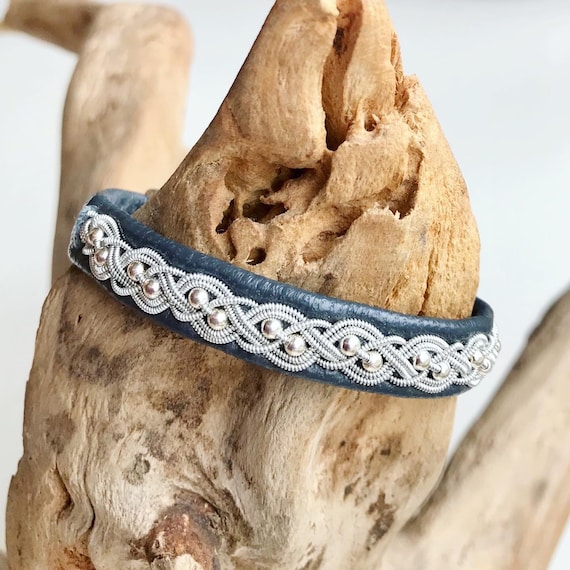 Swedish reindeer leather bracelet with sterling silver beads. Pewter braided.