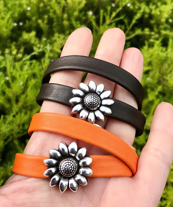 Wrap around reindeer leather bracelet with an sunflower magnetic silver clasp.