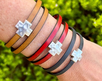 Double wrap around leather bracelet, with a silver cross magnetic clasp.