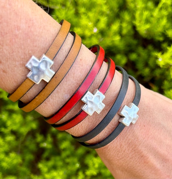 Double wrap around leather bracelet, with a silver cross magnetic clasp.