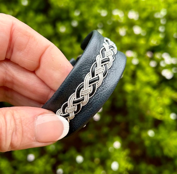 Traditional Nordic Viking cuff in reindeer leather and pewter.