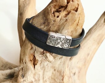 Wrap around reindeer leather bracelet with an intricate magnetic silver clasp.