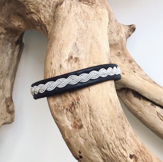 Sami reindeer leather unisex bracelets, with a wavy pewter braid.A unisex design.