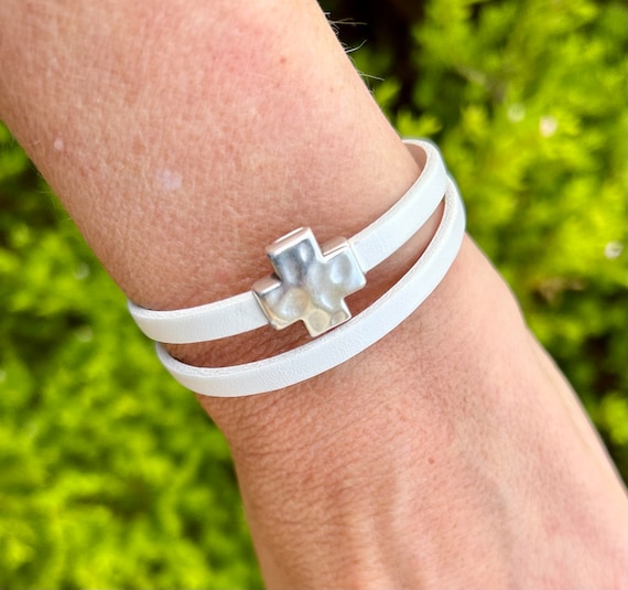 Double wrap around leather bracelet, with a silver cross magnetic clasp. Listing is for ONE bracelet.