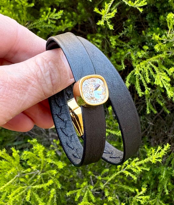 Wrap around Nordicreindeer leather bracelet with magnetic clasp and a brilliant square crystal slider in gold setting.