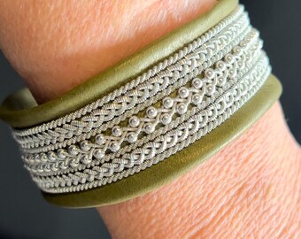 Sami inspired leather cuffs, with pewter threads and sterling silver beads.
