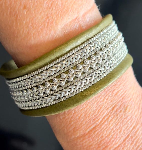 Sami inspired leather cuffs, with pewter threads and sterling silver beads.