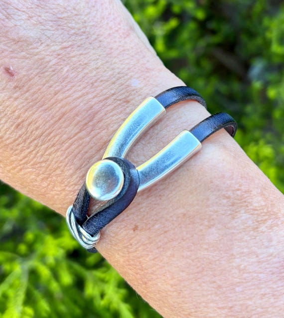 Wrap around leather bracelet, with a silver wishbone hook clasp.