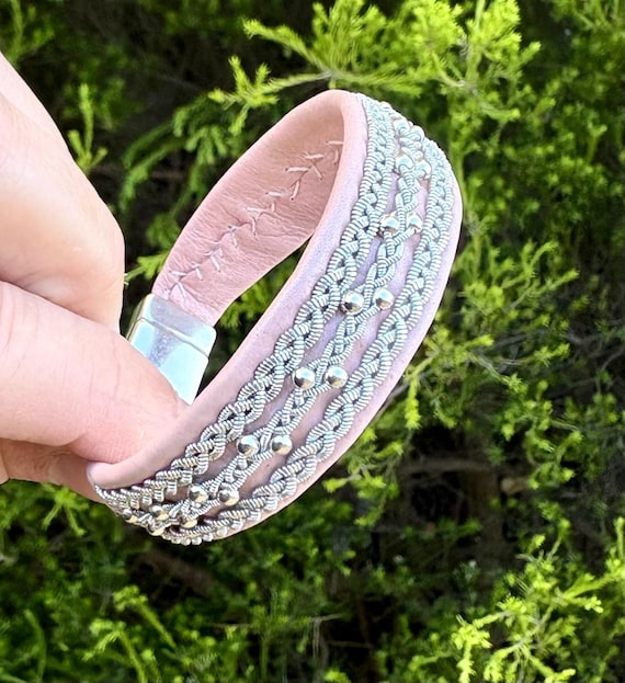 Nordic Sami inspired reindeer leather bracelet with a sterling silver beads row and traditional flat braid borders.