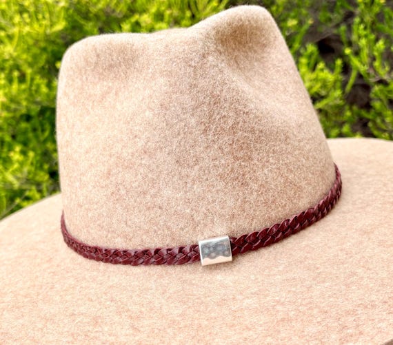 Kangaroo lace hand braided hatbands, finished off on reindeer leather with adjustable fastening and a silver hammered rectangular slider.