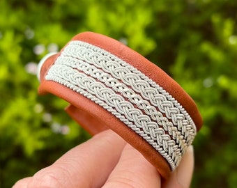 Traditional Nordic Sami inspired leather cuff, with pewter thread braids and pewter button. Unisex braided accessory.