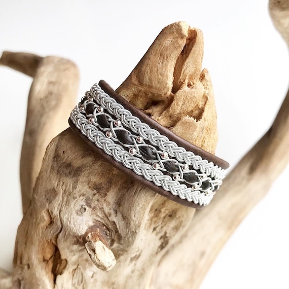 Lappland Sami reindeer leather bracelet with a sterling silver beads row and traditional braids.