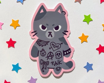 May include: A gray cat sticker with a pink outline. The cat has a grumpy expression and is wearing a shirt with a variety of tattoos, including a heart with the word "MOM", a skull, an anarchy symbol, a flame, a bow, and the word "PUNK".