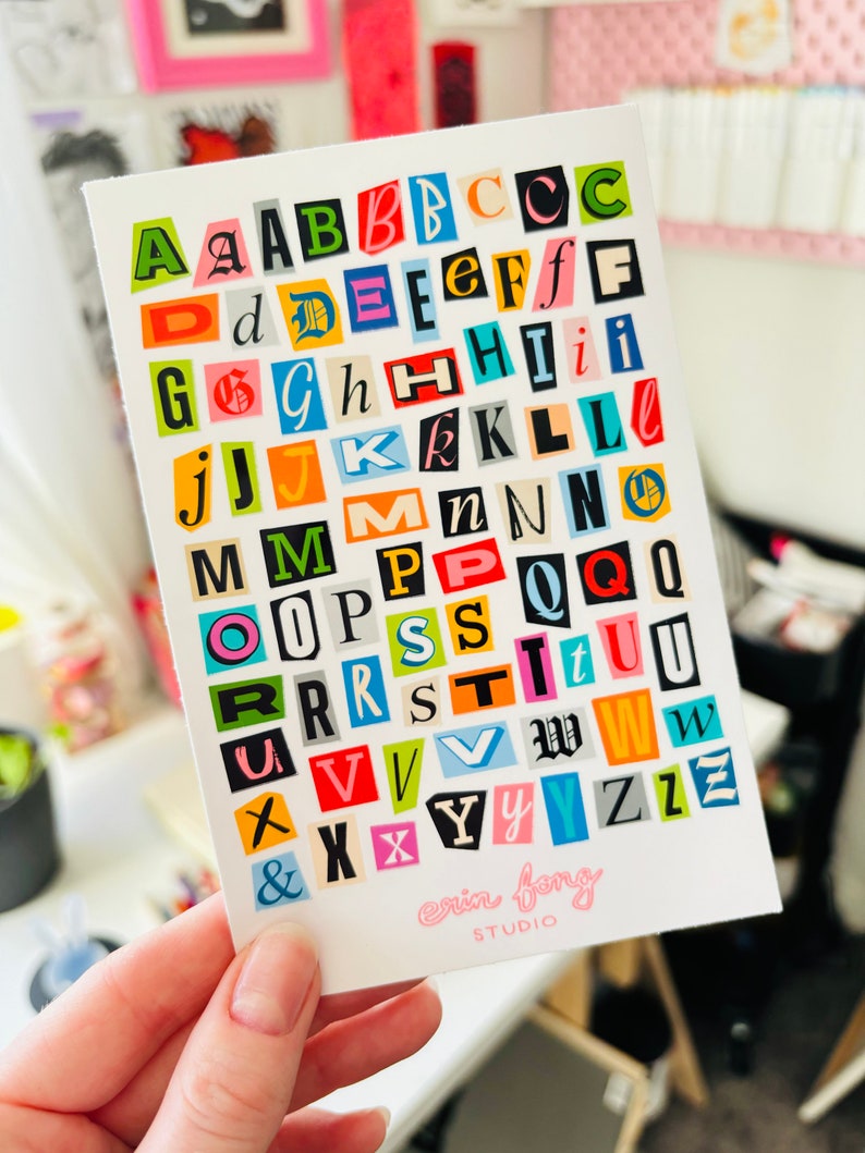 Ransom note letters on sticker sheet held up