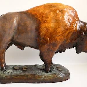 American bison sculpture. Buffalo statue, original clay ornament, Wild West, Yellowstone national park wildlife, Grand Teton
