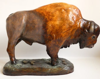 American bison sculpture. Buffalo statue, original clay ornament, Wild West, Yellowstone national park wildlife, Grand Teton