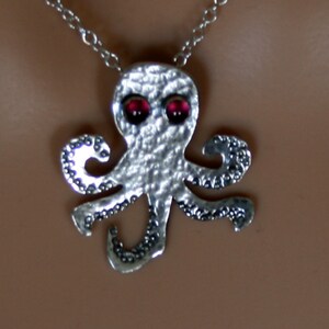 From the Deep ~ Sterling silver Baby Octopus Pendant with Garnet eyes 'Oceans & Ice' collection. Fully UK Hallmarked Eco-friendly Silver.