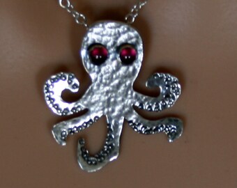 From the Deep ~ Sterling silver Baby Octopus Pendant with Garnet eyes 'Oceans & Ice' collection. Fully UK Hallmarked Eco-friendly Silver.