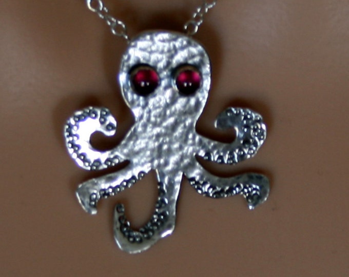 From the Deep ~ Sterling silver Baby Octopus Pendant with Garnet eyes 'Oceans & Ice' collection. Fully UK Hallmarked Eco-friendly Silver.