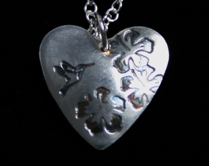 Handmade 'Amore ~ Hummingbird' pendant. Traditionally made, hand stamped Sterling Silver heart pendant with a hummingbird & hibiscus flowers