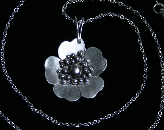 Exclusive 'Wild Rose' designer Pendant. Traditionally hand made with a satin rose for subtlety. Fully UK Hallmarked Sterling Silver.