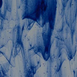 May include: Rectangular glass piece with a flowing, abstract design in shades of blue and white. The pattern resembles swirling water or smoke, creating a dynamic and artistic visual effect. The edges are smooth and rounded.