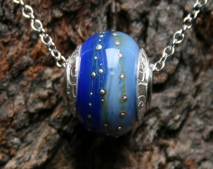 Ocean Depths ~ Lampwork big hole focal bead. Hand made full sterling silver core & end caps. Fine silver wrapped. Organic. Deep sea blues.