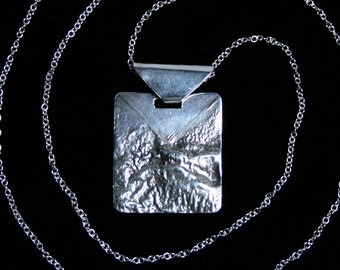 Handmade 'Echoes' Pendant. Traditionally hand made landscape pendant made from reticulated silver. Fully UK Hallmarked Sterling Silver.