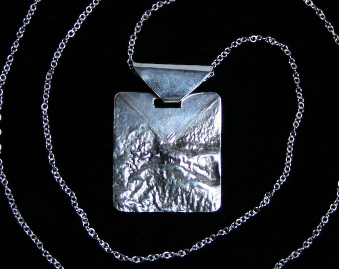 Handmade 'Echoes' Pendant. Traditionally hand made landscape pendant made from reticulated silver. Fully UK Hallmarked Sterling Silver.