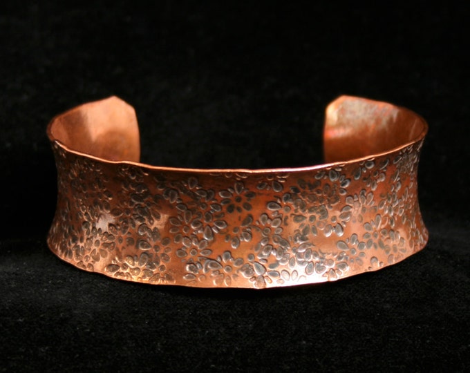 Medium anticlastic cuff bracelet 'Daisy' Traditionally hand made with a hand stamped pattern. Torched flame finish copper.