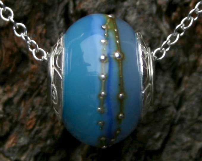 Tahiti ~ Lampwork big hole Focal bead. Hand made full sterling silver core & caps. Fine silver wrapped. Organic. Translucent warm sea blues.