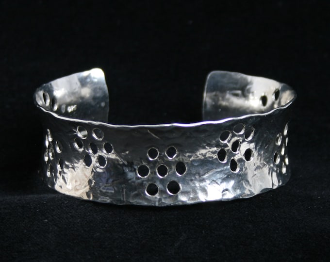 Medium anticlastic cuff bracelet 'Lydia ~ Flower' Traditionally hand made with hammered finish for added sparkle. Fully UK Hallmarked Silver