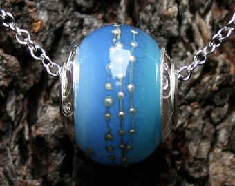 Neptune ~ Lampwork big hole Focal bead. Hand made full sterling silver core & caps. Fine silver wrapped. Organic. Translucent warm sea blues