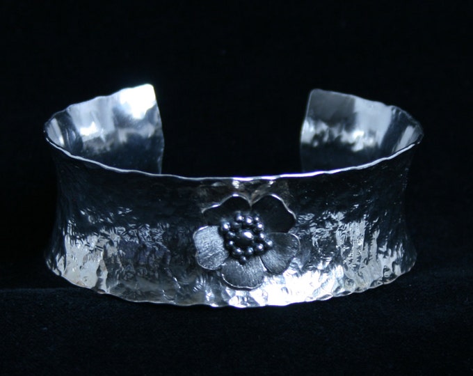Medium anticlastic cuff bracelet. 'Wild Rose' Traditionally hand made with hammered finish for added sparkle. Fully UK Hallmarked Silver.