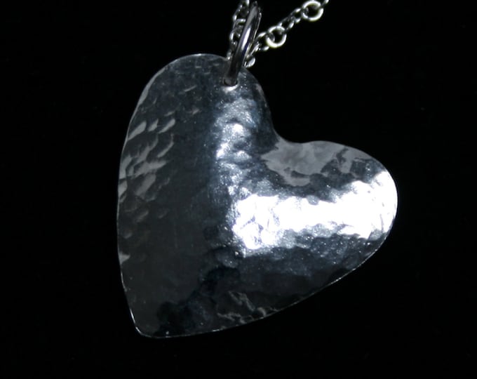 Handmade 'Amore ~ Monad' pendant. Traditionally hand made Sterling Silver heart pendant with a hammered finish for extra sparkle.