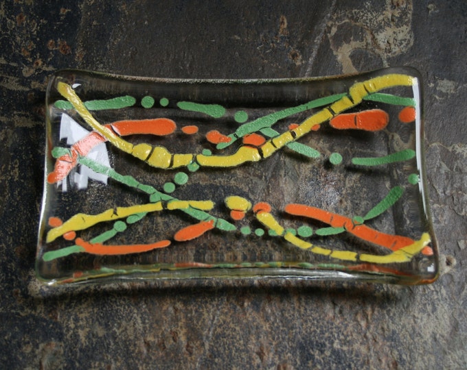 Serpentine series 'Fruity!'  (D2)    Fused glass soap / trinket / mini sushi / chocolates dish in Orange, yellow and green on a clear base.