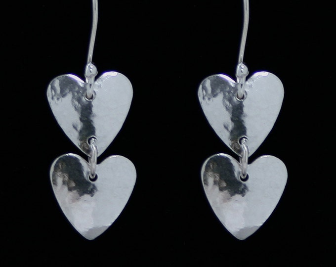 Handmade 'Amore ~ Dyad' earrings. Traditionally hand made, sterling silver twin heart drop earrings. Fish hook ear wires for pierced ears.
