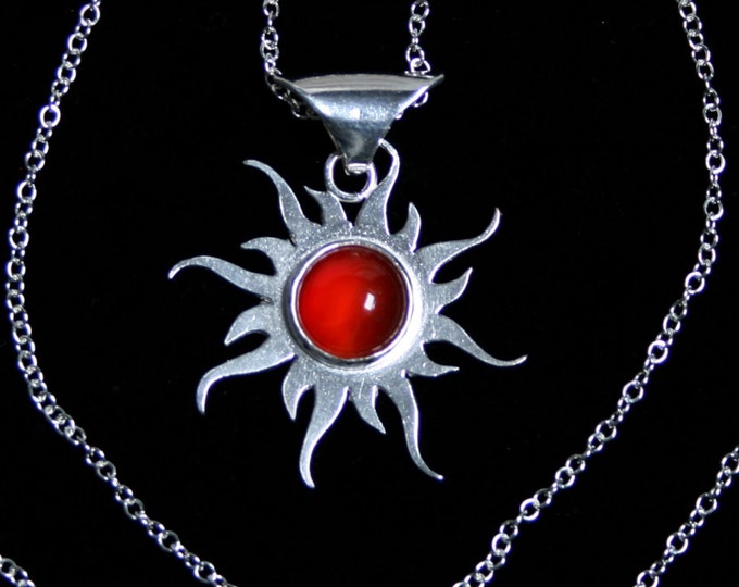 Carnelian 'Tribal Sun' Pendant. Eco friendly hand made sun pendant set with a Carnelian in the center. Fully UK Hallmarked Sterling Silver.
