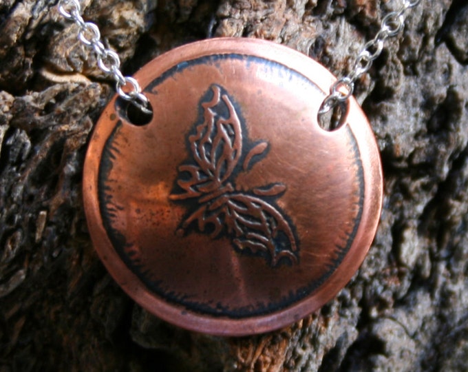 Handmade 'Tribal butterfly 1' Butterfly pendant. Antiqued, etched, domed, copper round pendant on a sterling silver chain.