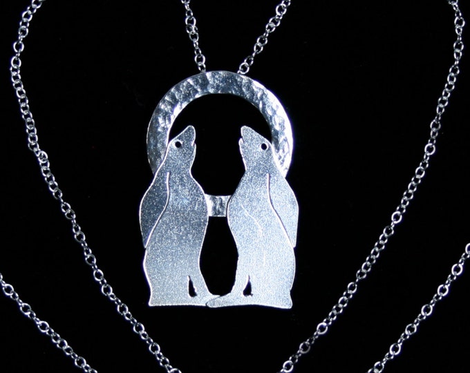 Traditionally handmade 'Moongazing Hare' Pendant. A pair of moongazing hares set against a full moon. Fully UK Hallmarked Sterling Silver