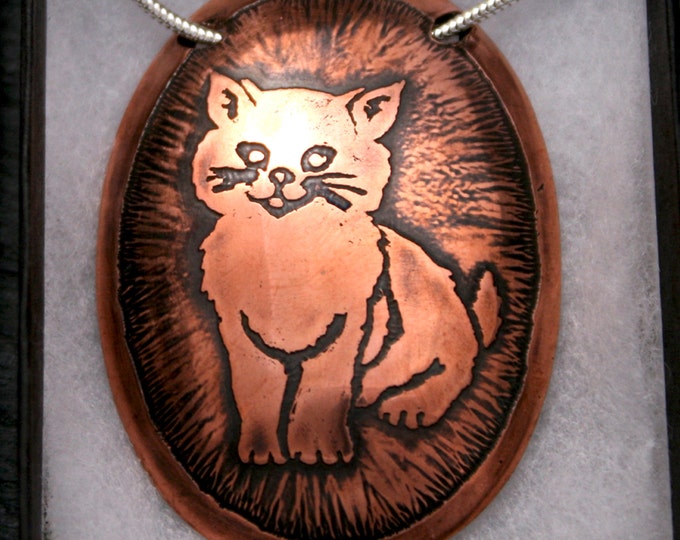 Handmade Happy Kitty pendant. Antiqued, etched, domed copper oval cat pendant on a sterling silver snake chain