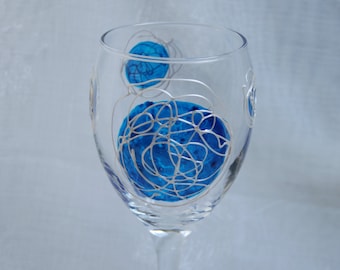 Galaxy - Blue and Pearl - An exclusive design, hand painted, wine glass featuring blue 'planets' swirled with raised pearl 'orbit trails'