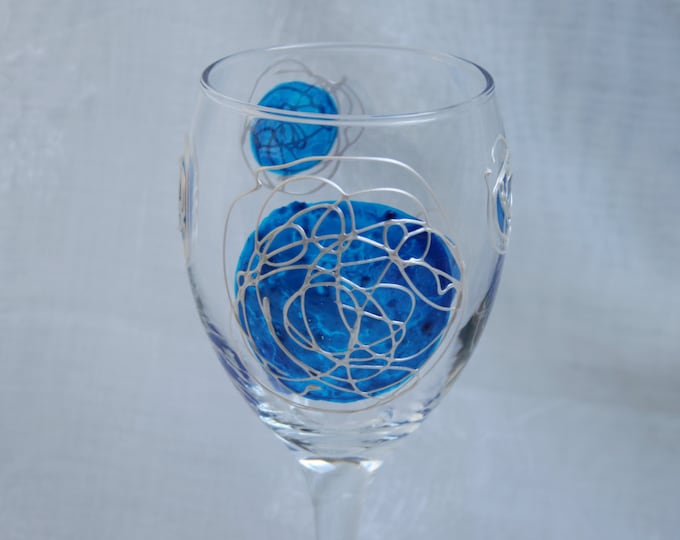 Galaxy - Blue and Pearl - An exclusive design, hand painted, wine glass featuring blue 'planets' swirled with raised pearl 'orbit trails'