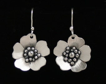 Exclusive 'Wild Rose' designer earrings. Traditionally hand made, sterling silver floral drop earrings. Fish hook ear wires for pierced ears